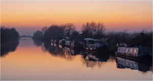 18 Points-Tranquil canal at sunset-Diana Baker